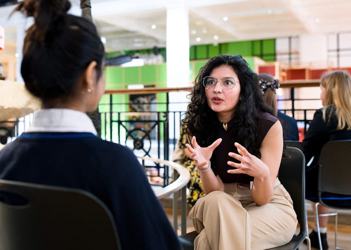 QEPrize Ambassador Aakeen with a student