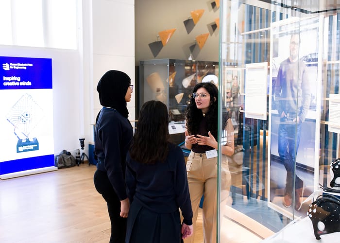 QEPrize Ambassador Aakeen with students exploring the Engineers gallery